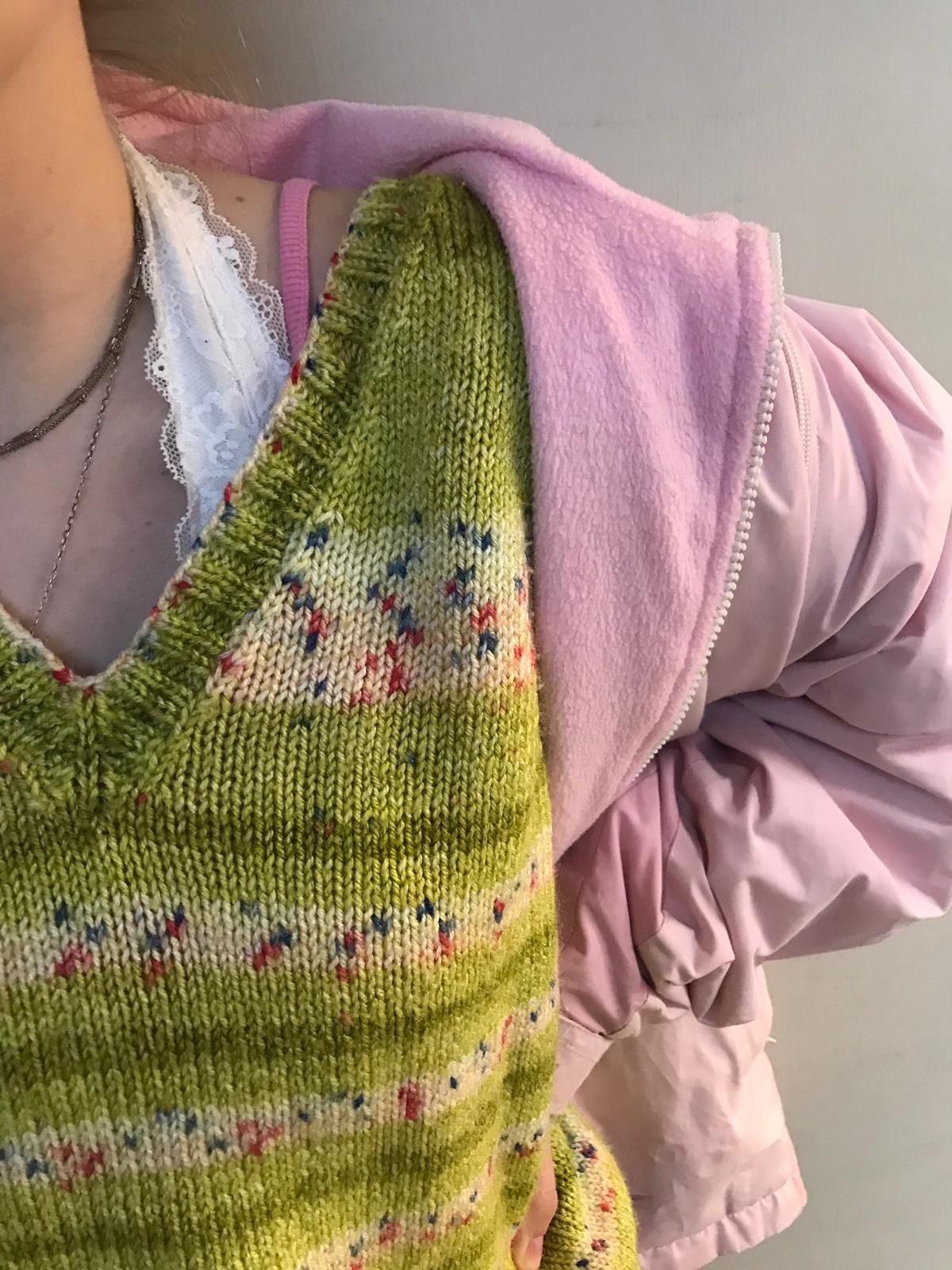 Image may contain: Cardigan, Knitting, Human, Person, Sweater, Clothing, Apparel
