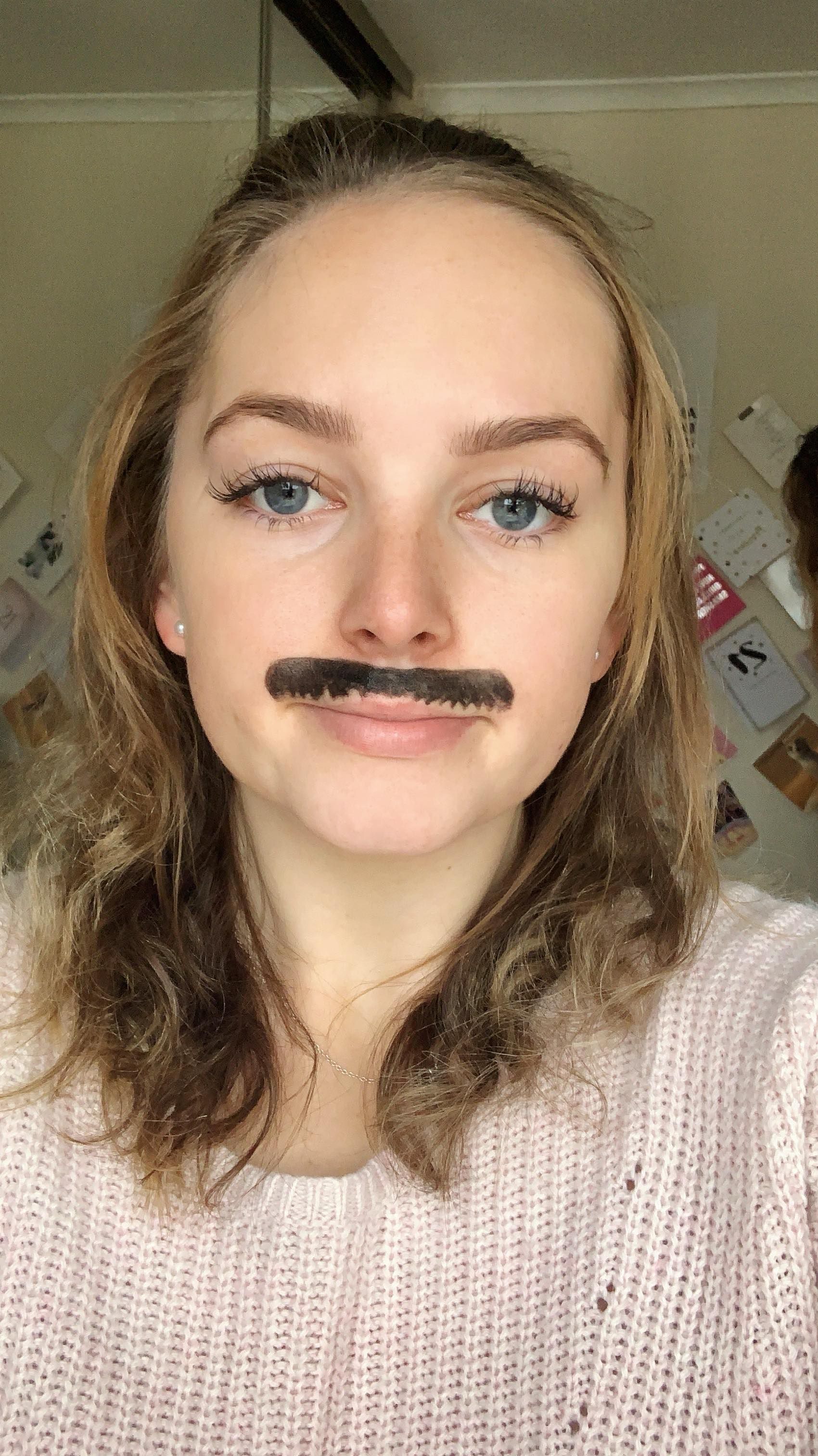 Image may contain: Mustache, Person, Face, Human