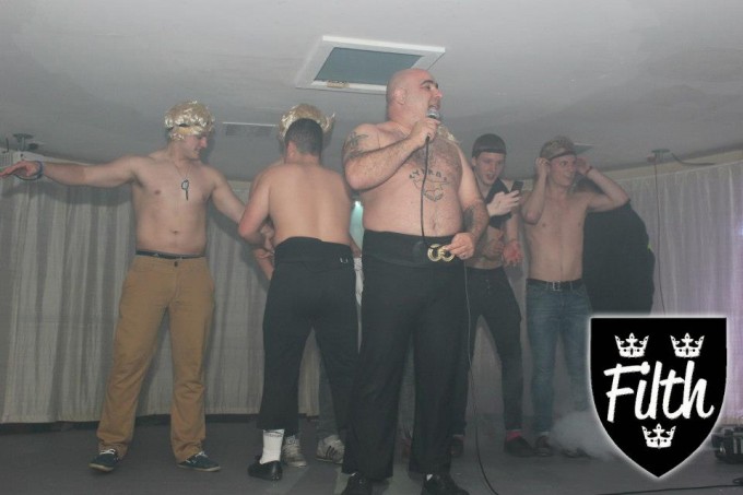 The backing dancers limber up
