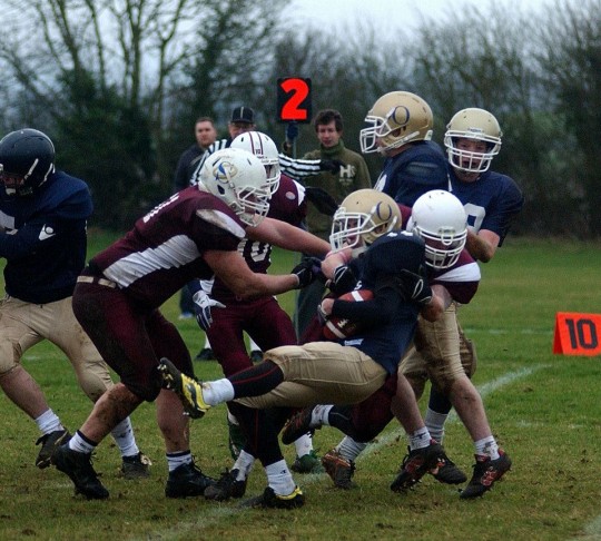 Guy played in last year's game. Here is a photo of him being flattened. 