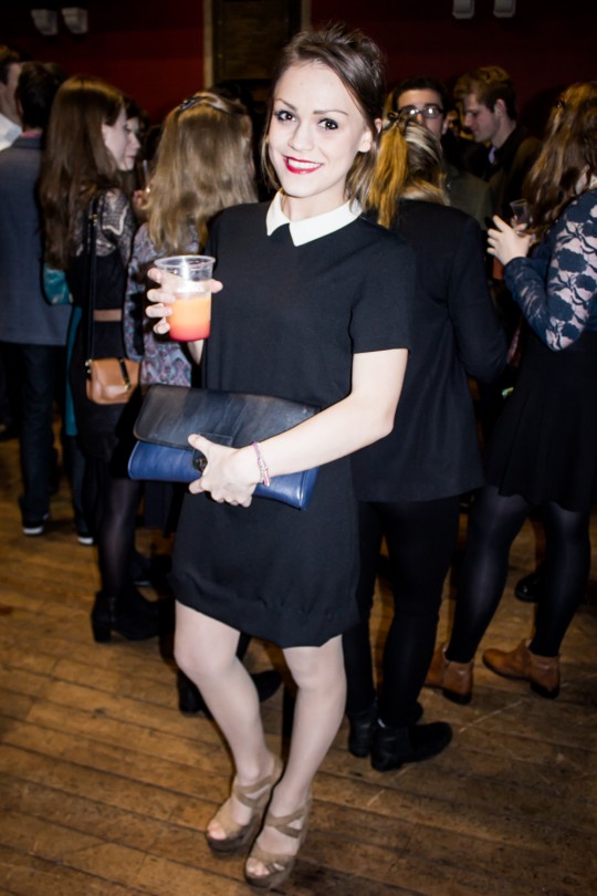 We love this girl's take on the little black dress paired with a sophisticated leather clutch.