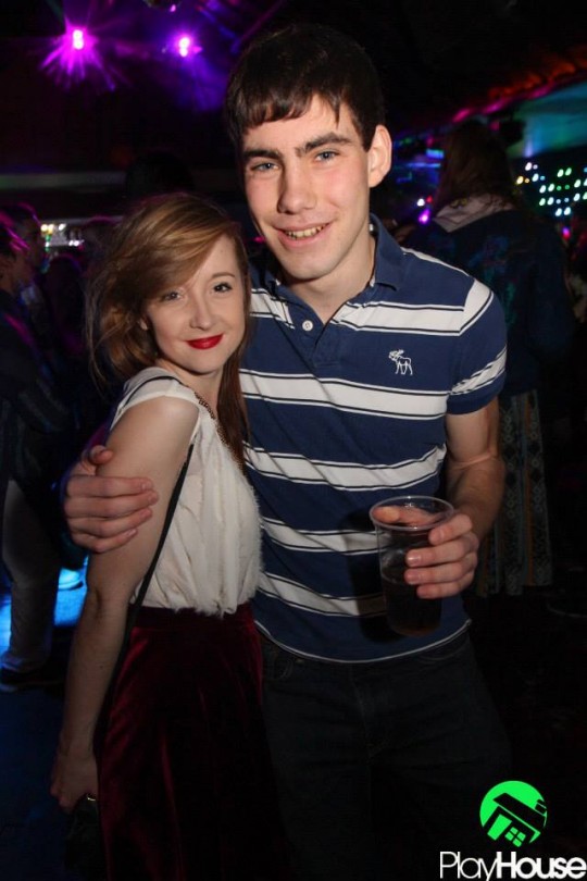 The splash of red lipstick really  compliments the deep tones of her velvet skater skirt!