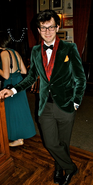 Green velvet blazer. Crimson scarf. Golden pocket square. This gent has all the colours added to his tux to amount to a great evening. And he clearly has the intelligence and attitude to go with it.