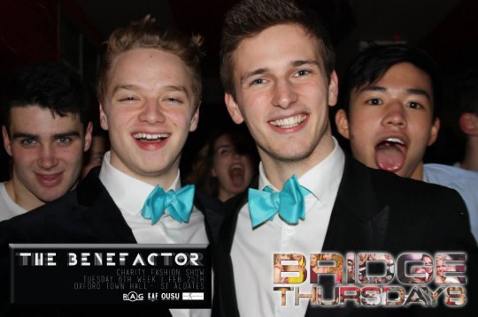 These boys want to make bubble gum blue bow ties a trend, and they aren't going to let three separate photo bombers deter them