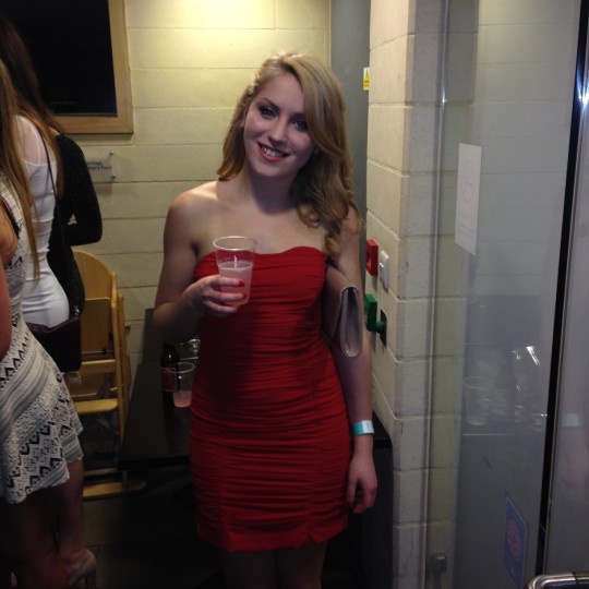 This little red dress compliments this lady's fair complexion perfectly!