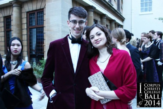 This co-ordinated couple complement each other's berry outfits. We especially love this bold jacket choice from this man