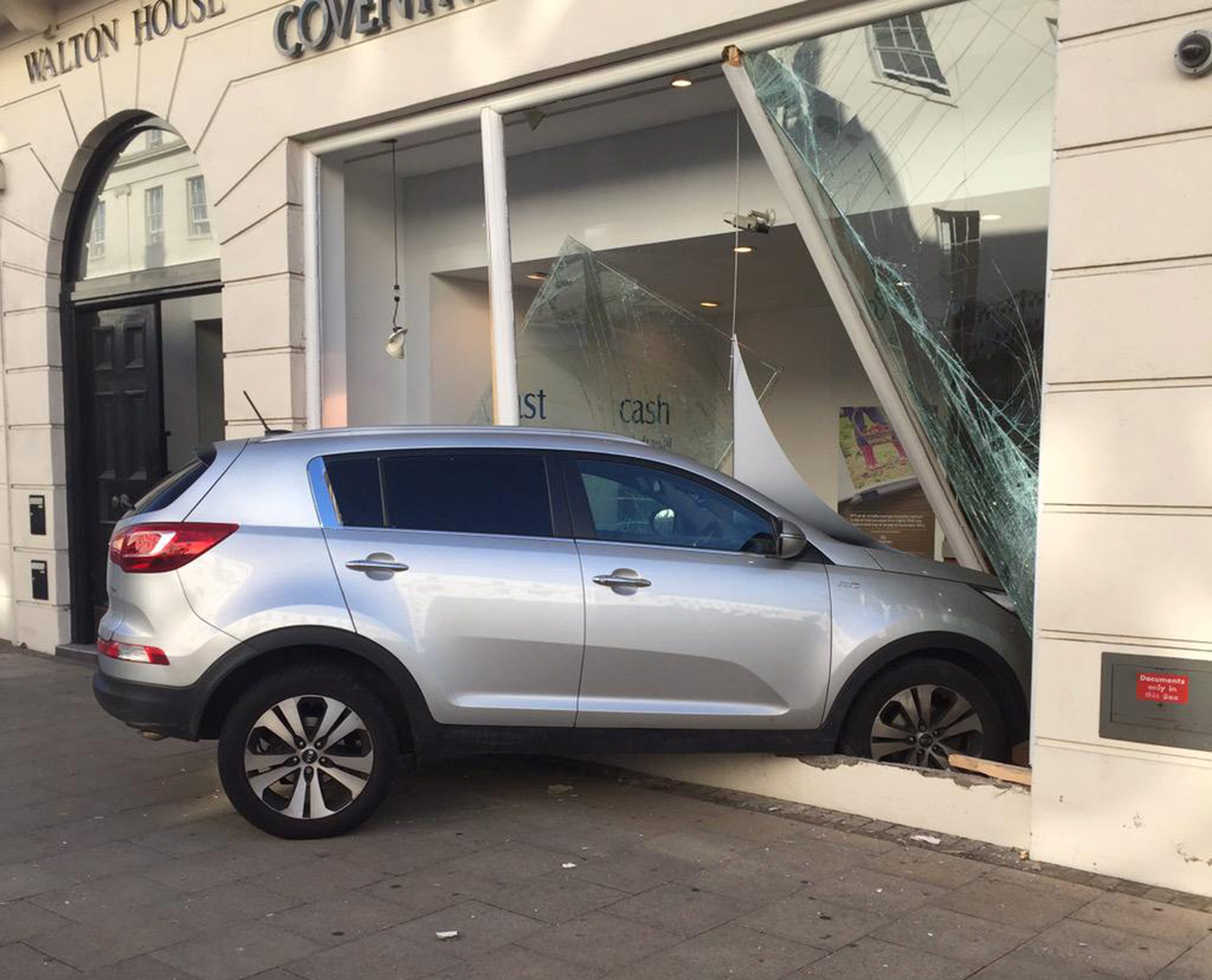 A car crashed through the window of Coventry Building SocietyÃs, Leamington town centre branch this morning.  See NTI story NTIROBBERY.  The incident happened shortly before 9am this morning as commuters made their way to work in the busy Leamington town centre.  A grey Kia smashed through the front window of the building societyÃs upper Parade branch.  Warwickshire Police are at the scene, but nobody has been arrested and it is not yet known if anyone has been injured.  A spokesman for Warwickshire Police said: "We were called just after 8.30am to reports of a robbery at Coventry Building Society on the Parade, in Leamington Spa.  Officers are currently at the scene dealing with the incident."