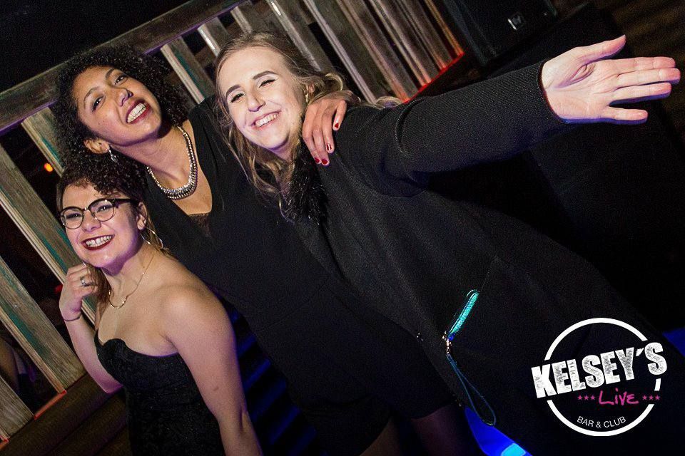 Image may contain: Night Life, Night Club, Club, Shirt, Clothing, Smile, Portrait, Face, Person, People, Human