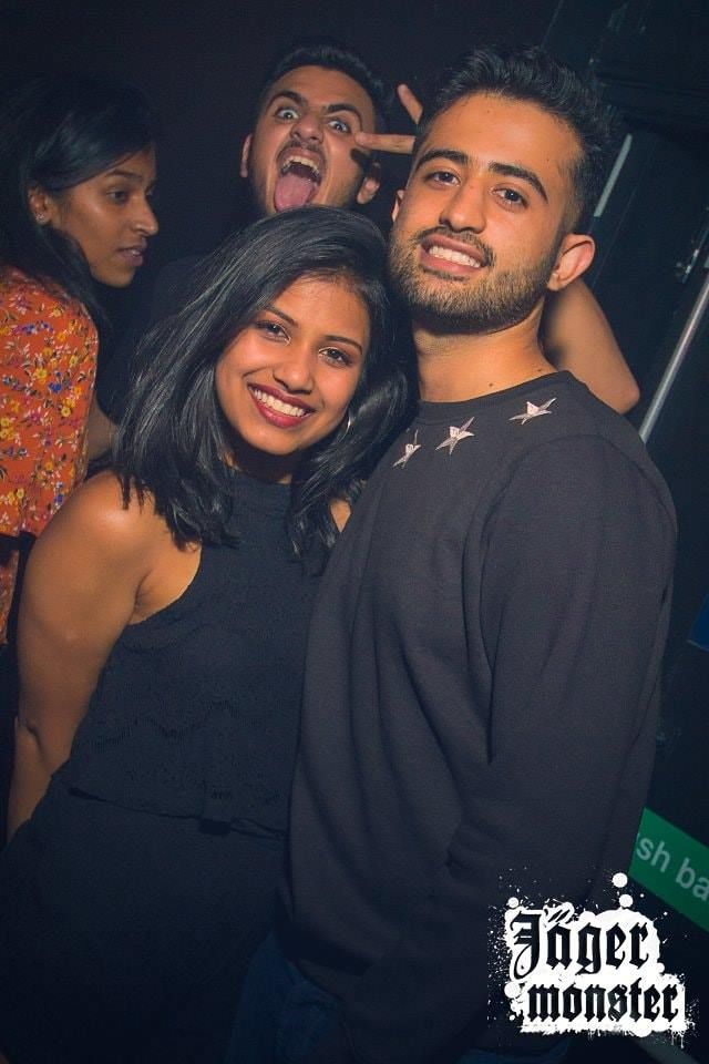 Image may contain: Night Life, Night Club, Club, Smile, Portrait, Face, Person, People, Human