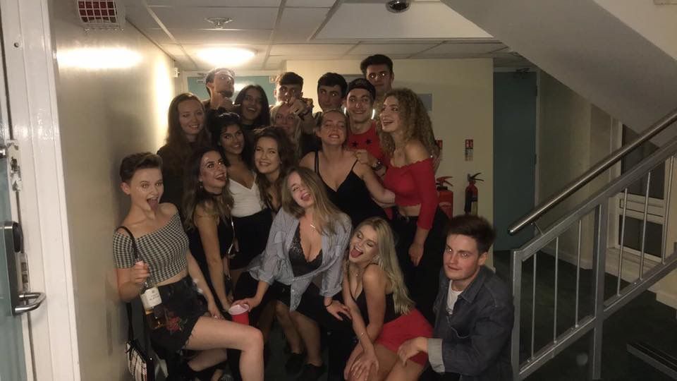 Image may contain: Night Life, Staircase, Handrail, Banister, Party, Person, People, Human