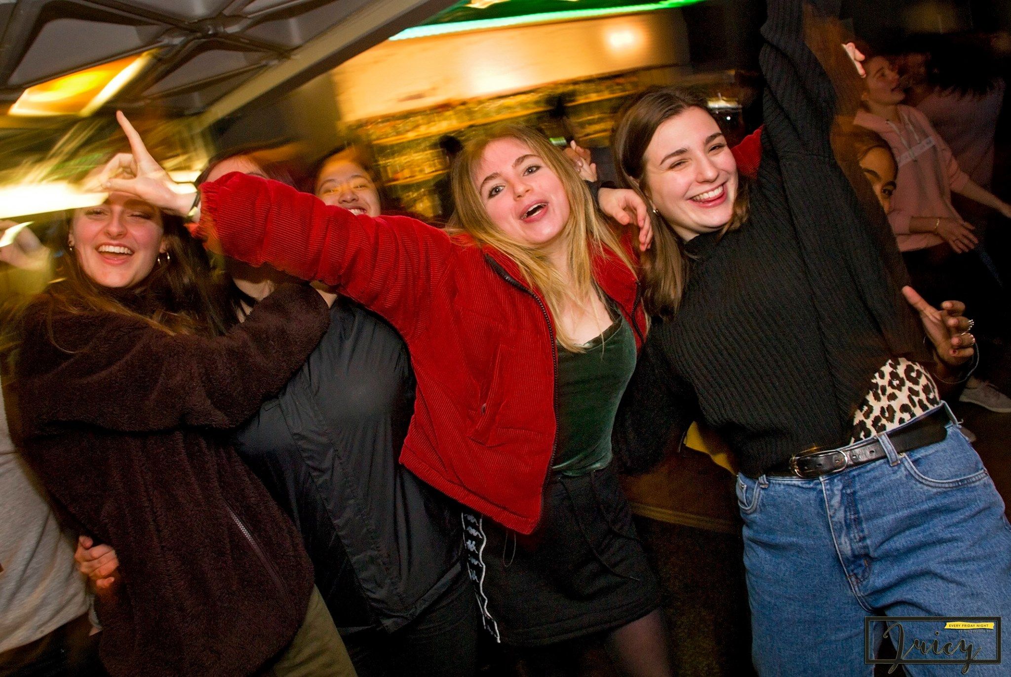 Image may contain: Bar Counter, Pub, Jeans, Denim, Night Life, Night Club, Club, Pants, Clothing, Apparel, Person, Human