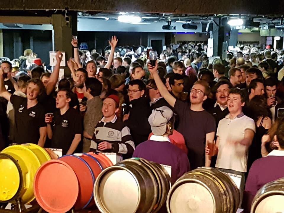 Image may contain: Barrel, Musical Instrument, Drum, Percussion, People, Audience, Skin, Crowd, Person, Human
