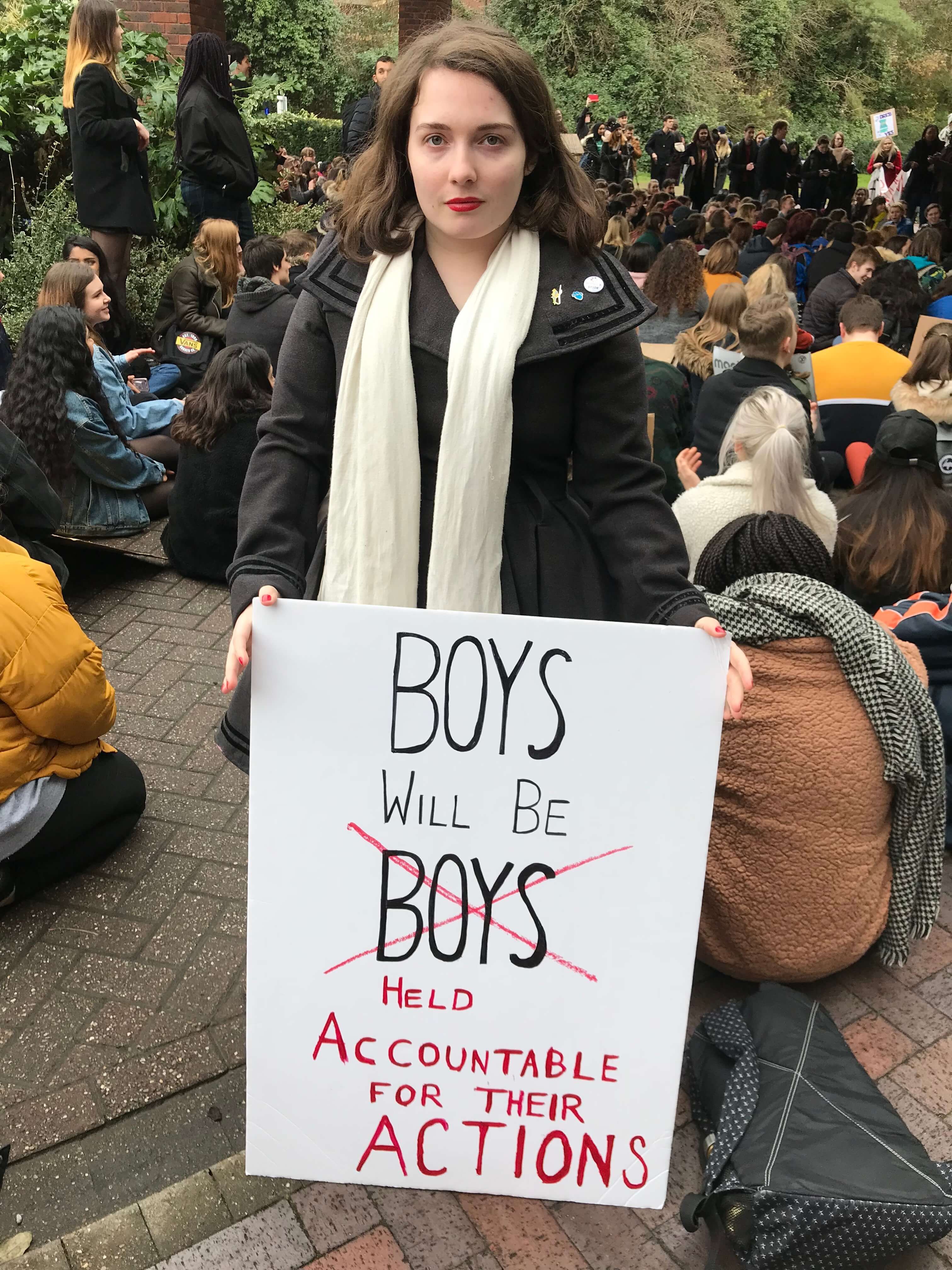 Image may contain: Text, Crowd, Apparel, Clothing, Human, Person