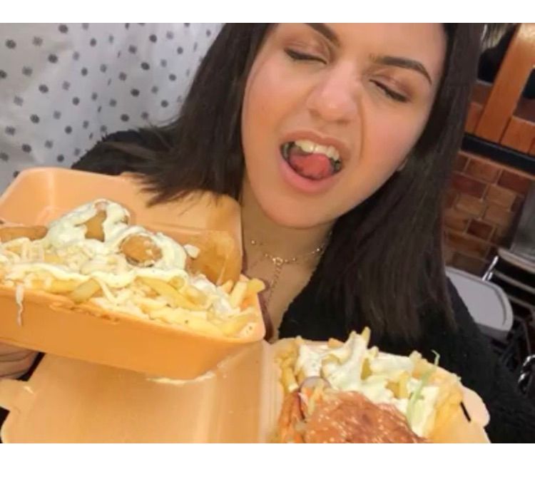 Image may contain: Female, Face, Eating, Food, Human, Person