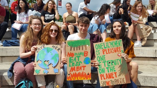Image may contain: Face, Protest, Text, People, Crowd, Parade, Accessory, Sunglasses, Accessories, Person, Human