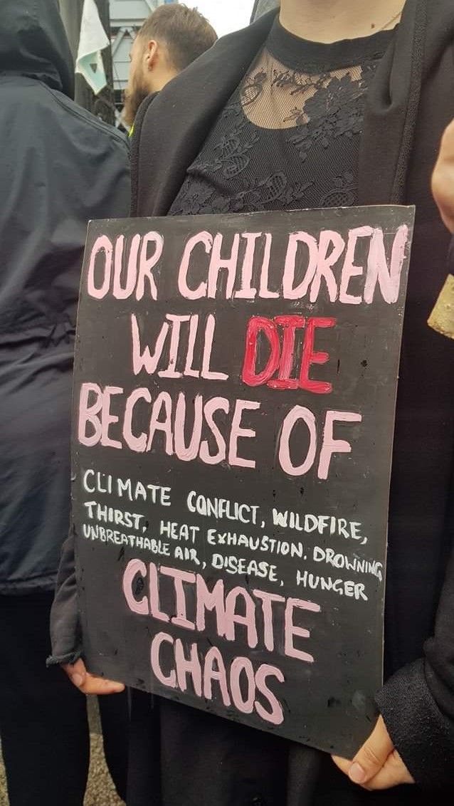 Image may contain: Blackboard, Banner, Human, Person, Word, Text