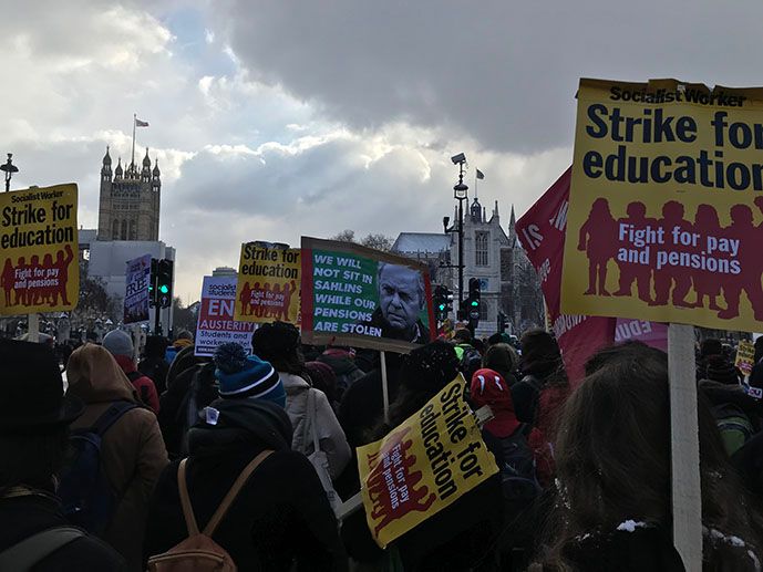 Image may contain: Crowd, Banner, Person, Human, Text