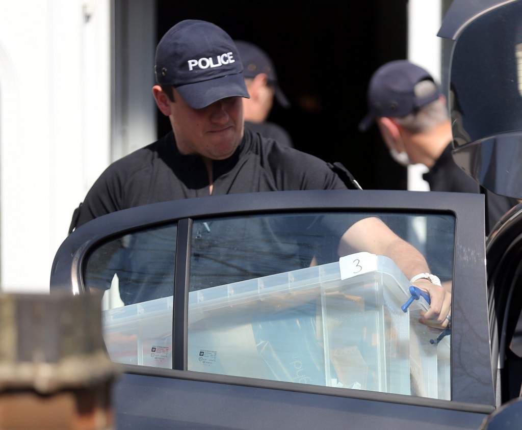Police removing evidence from a house in York