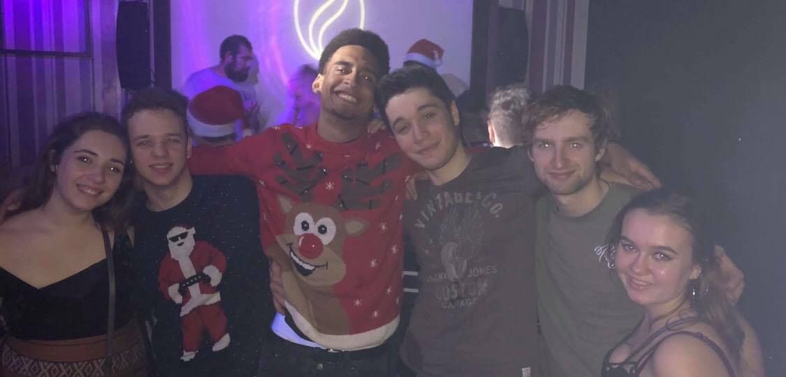 Image may contain: Portrait, Photo, Photography, Night Club, Smile, Head, Party, Club, Face, Night Life, Human, Person, Apparel, Clothing