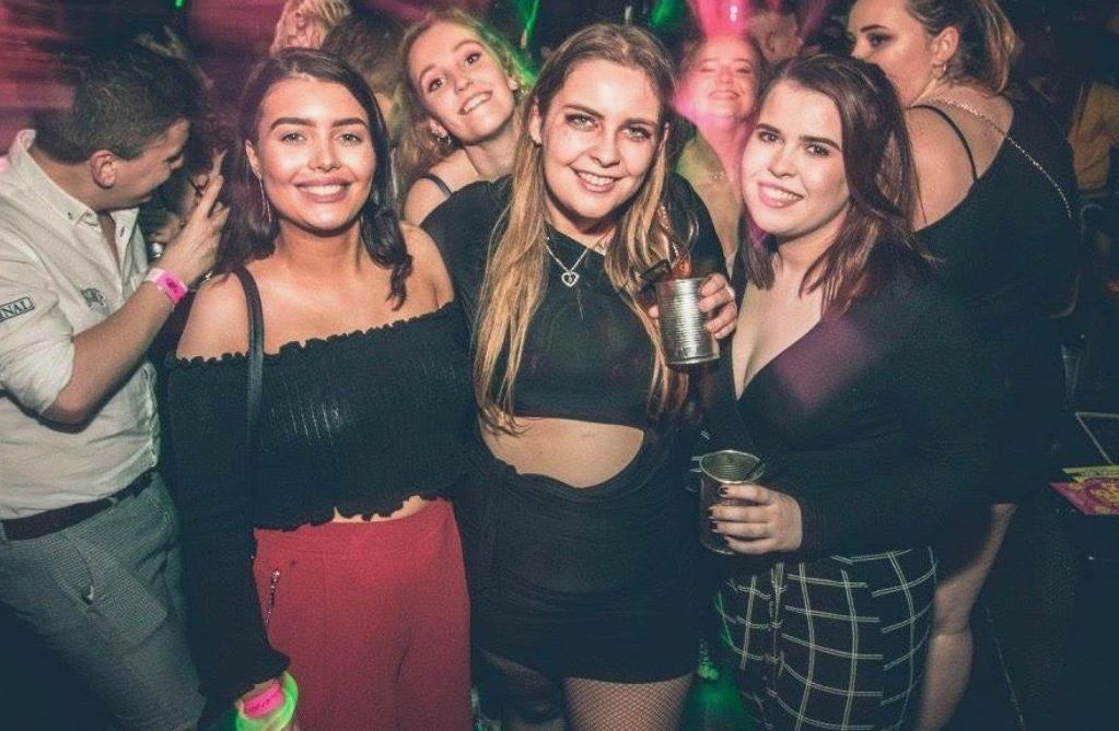 Image may contain: Beverage, Drink, Clothing, Apparel, Female, Night Life, Night Club, Club, Party, Human, Person