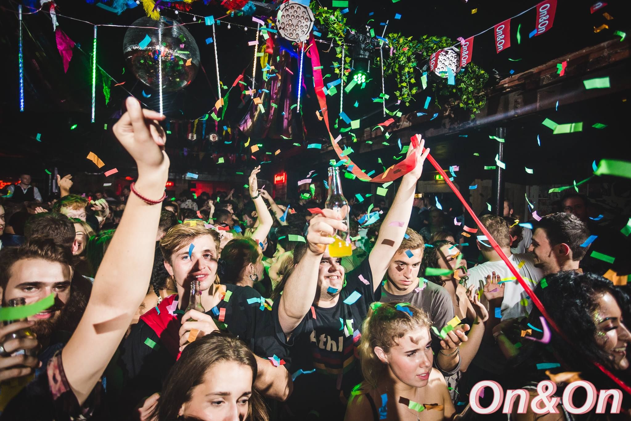 Image may contain: Crowd, Paper, Sunglasses, Accessories, Accessory, Night Life, Night Club, Club, Party, Human, Person
