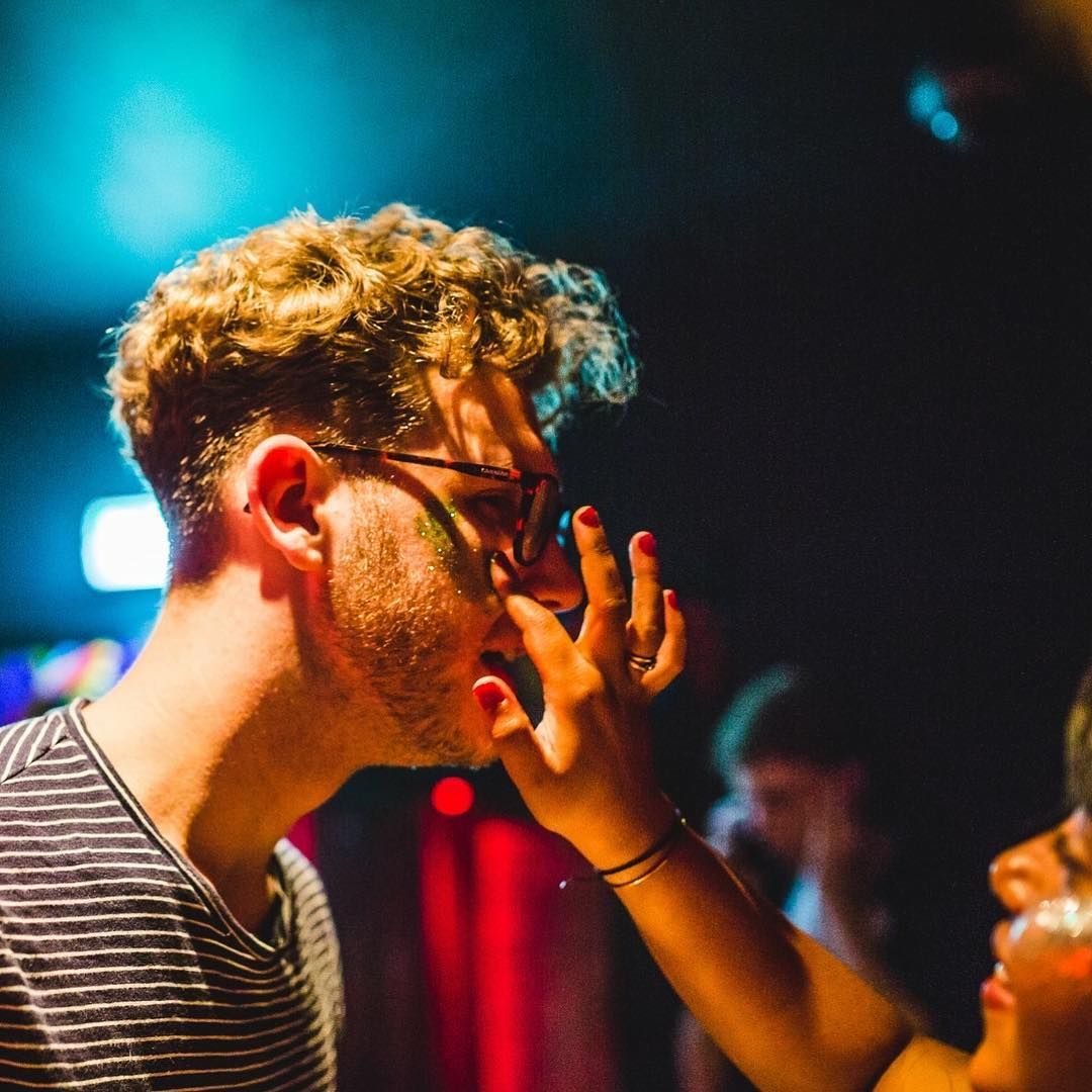 Image may contain: Face, Finger, Hair, Night Club, Club, Night Life, Human, Person