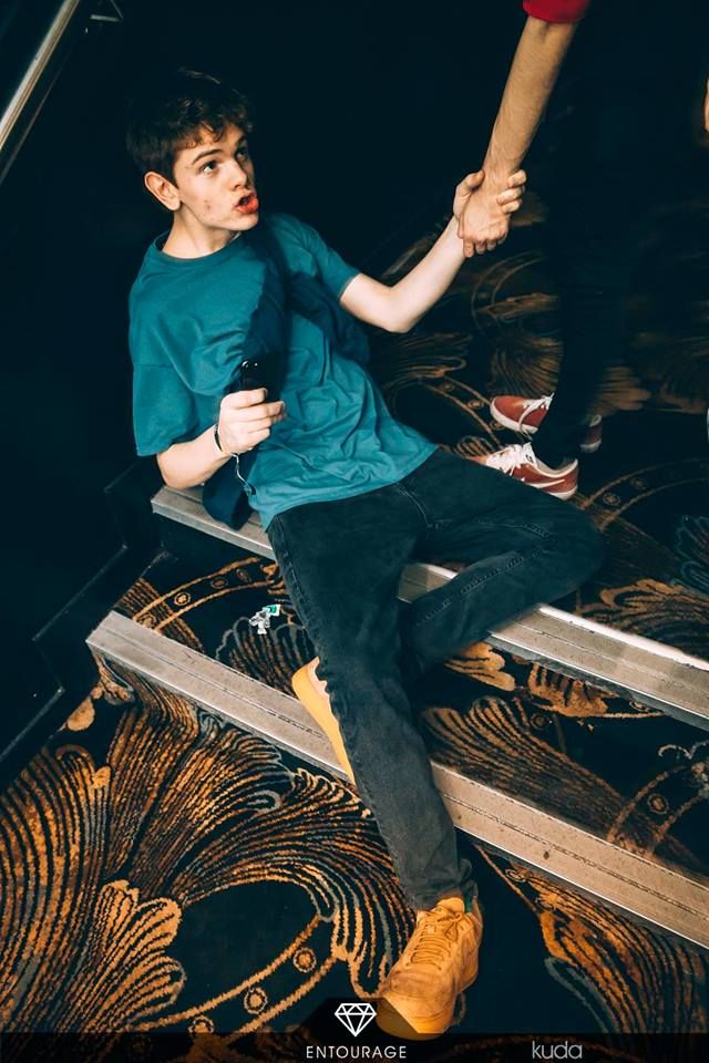 Image may contain: Musician, Musical Instrument, Jeans, Denim, Long Sleeve, Sleeve, Leisure Activities, Footwear, Shoe, Pants, Apparel, Clothing, Human, Person