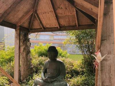 Image may contain: Building, Buddha, Art, Worship, Person, Human