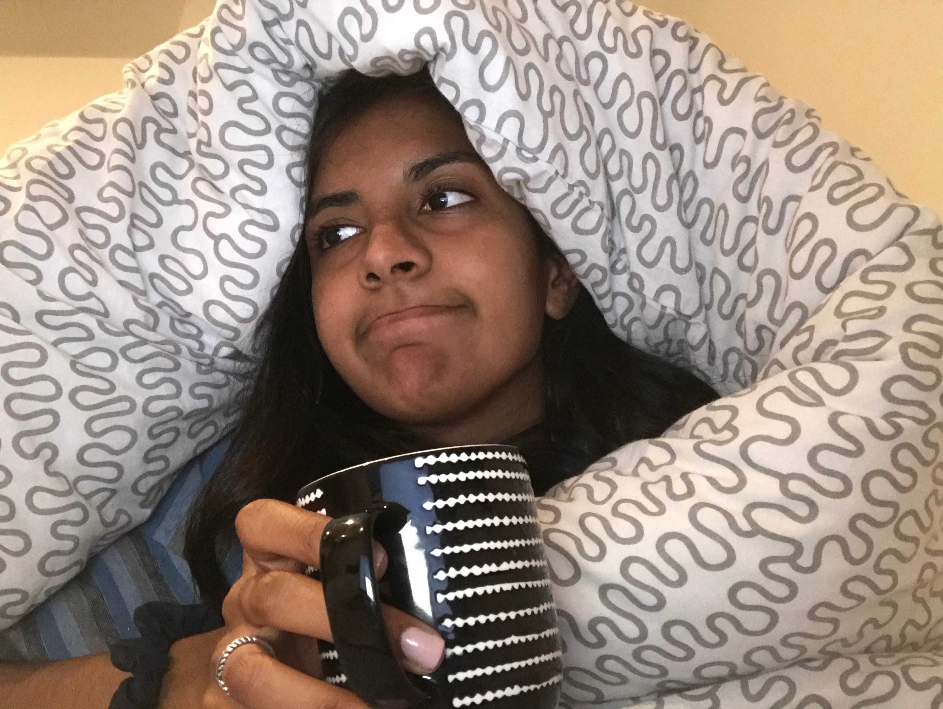 Image may contain: Face, Coffee Cup, Cup, Finger, Person, Human