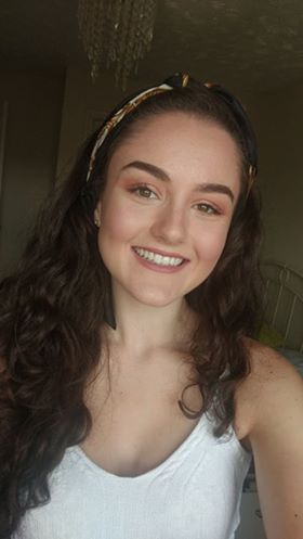 Image may contain: Photo, Portrait, Photography, Furniture, Lip, Teeth, Mouth, Hat, Headband, Hair, Dimples, Head, Apparel, Clothing, Smile, Person, Face, Human