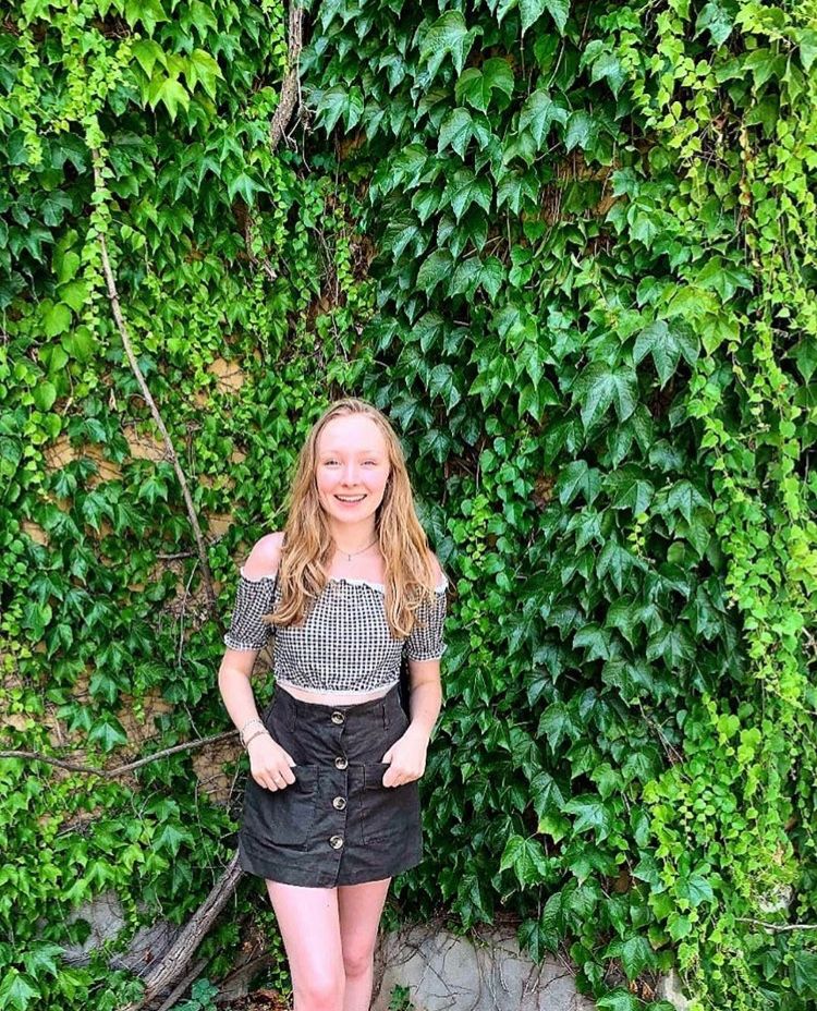 Image may contain: Vegetation, Photo, Photography, Portrait, Skirt, Face, Teen, Blonde, Girl, Kid, Child, Plant, Woman, Dress, Person, Human, Female, Clothing, Apparel