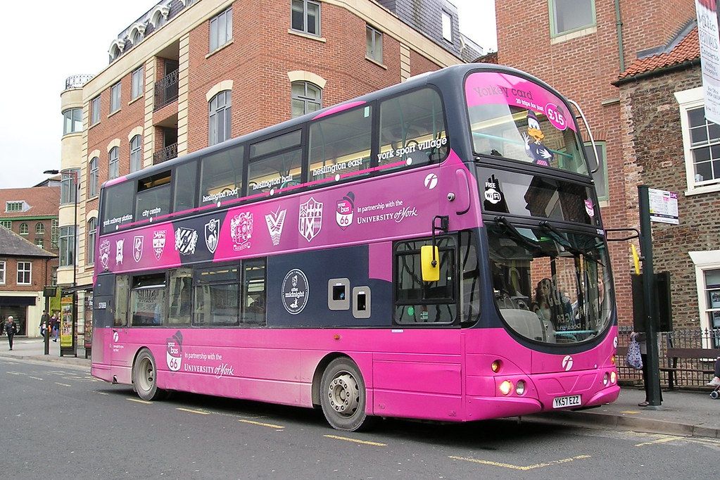 Image may contain: Double Decker Bus, Tour Bus, Person, Human, Vehicle, Transportation, Bus