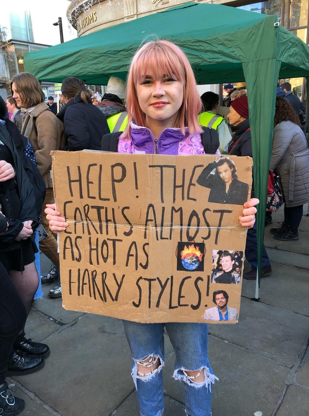 Image may contain: Crowd, Label, Tent, Word, Footwear, Clothing, Apparel, Shoe, Person, Human, Banner, Text