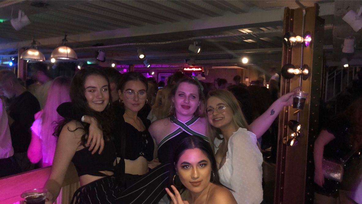 Image may contain: Apparel, Clothing, Female, Accessory, Accessories, Glasses, Bar Counter, Pub, Interior Design, Indoors, Night Club, Face, Club, Party, Human, Person, Night Life