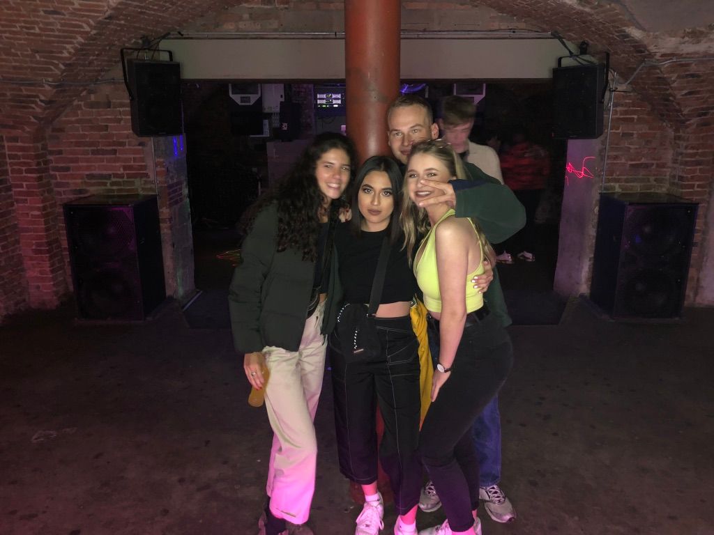 Image may contain: Pub, Bar Counter, Jeans, Denim, Pants, Night Life, Person, Human, Clothing, Footwear, Shoe, Apparel