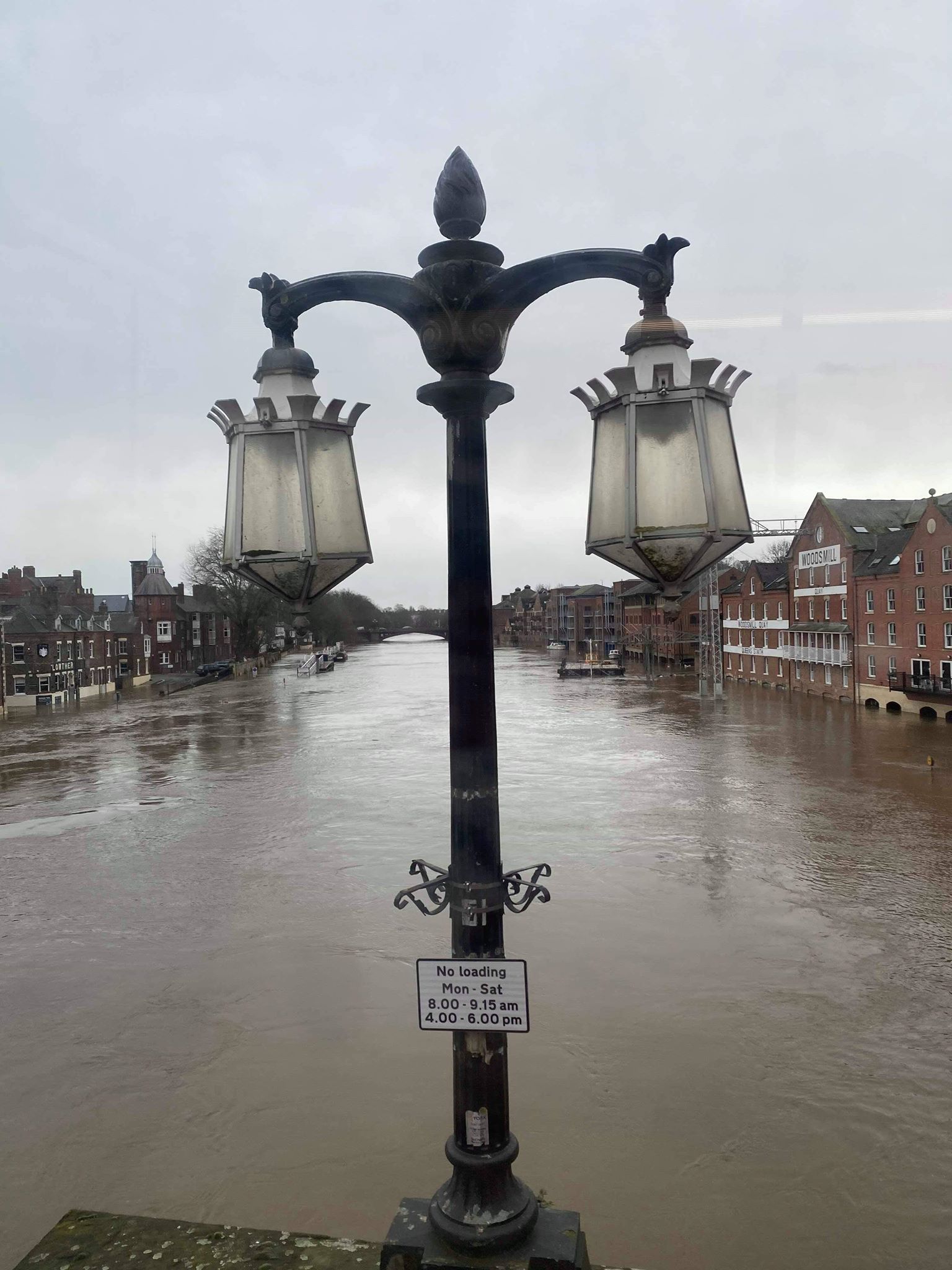 Image may contain: Outdoors, Lamp Post, Architecture, Building, Nature, Symbol, Cross