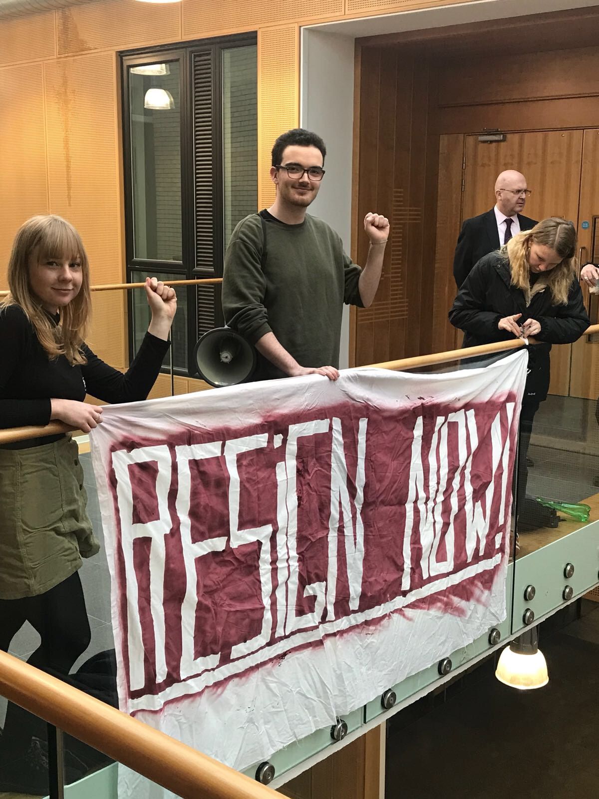 Image may contain: Speech, Crowd, Audience, Quilt, Home Decor, Person, People, Human