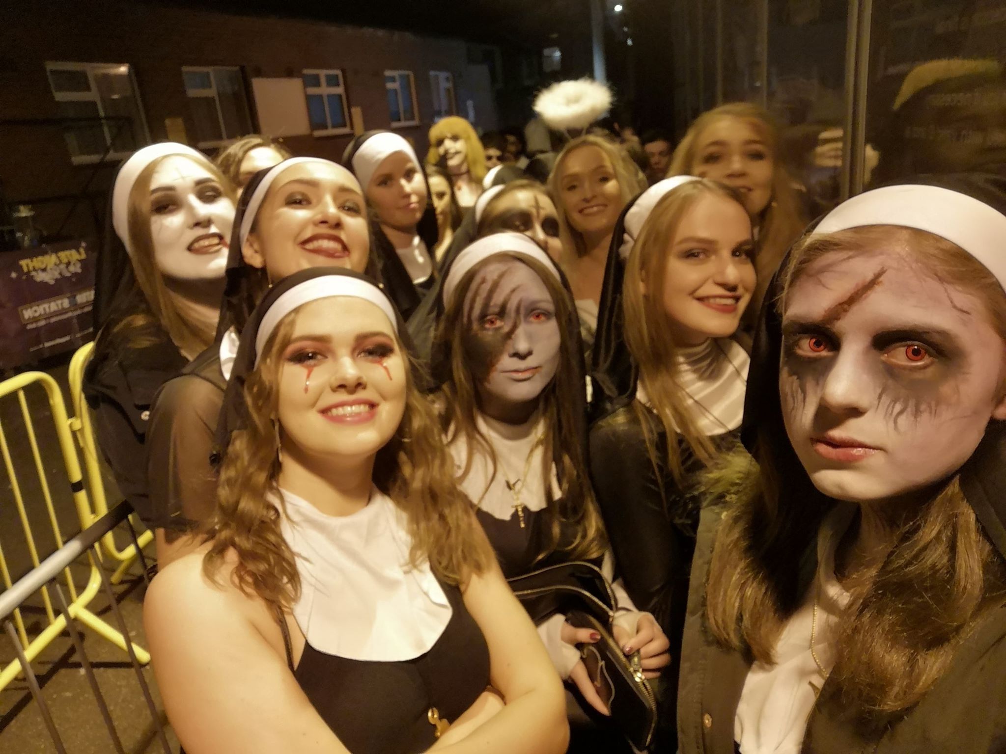 Image may contain: People, Head, Clothing, Apparel, Night Life, Face, Audience, Crowd, Human, Person