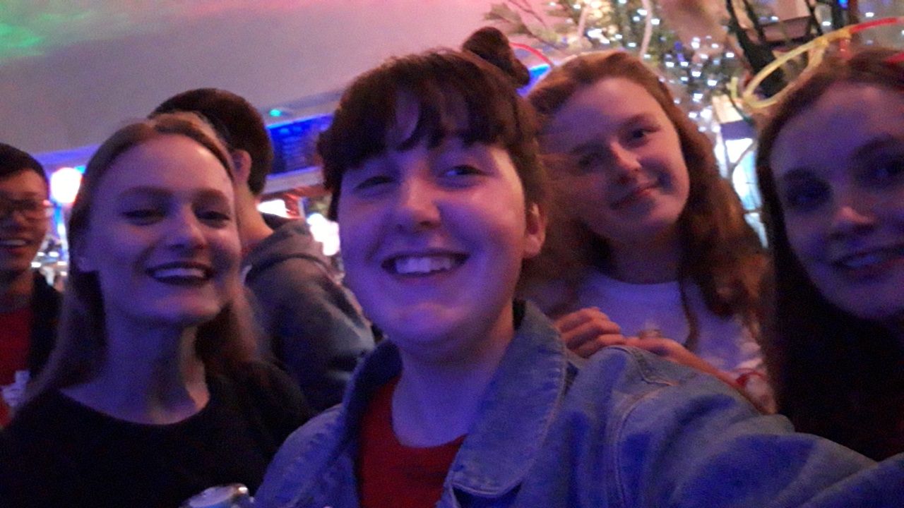 Image may contain: Audience, Selfie, Photo, Photography, Portrait, Teen, Female, Child, Girl, Blonde, Kid, Woman, Crowd, Smile, Head, Lighting, Bar Counter, Pub, Face, Night Life, Human, Person