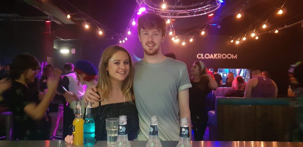 Image may contain: Beer, Alcohol, Bottle, Bar Counter, Pub, Night Life, Beverage, Drink, Night Club, Club, Party, Human, Person