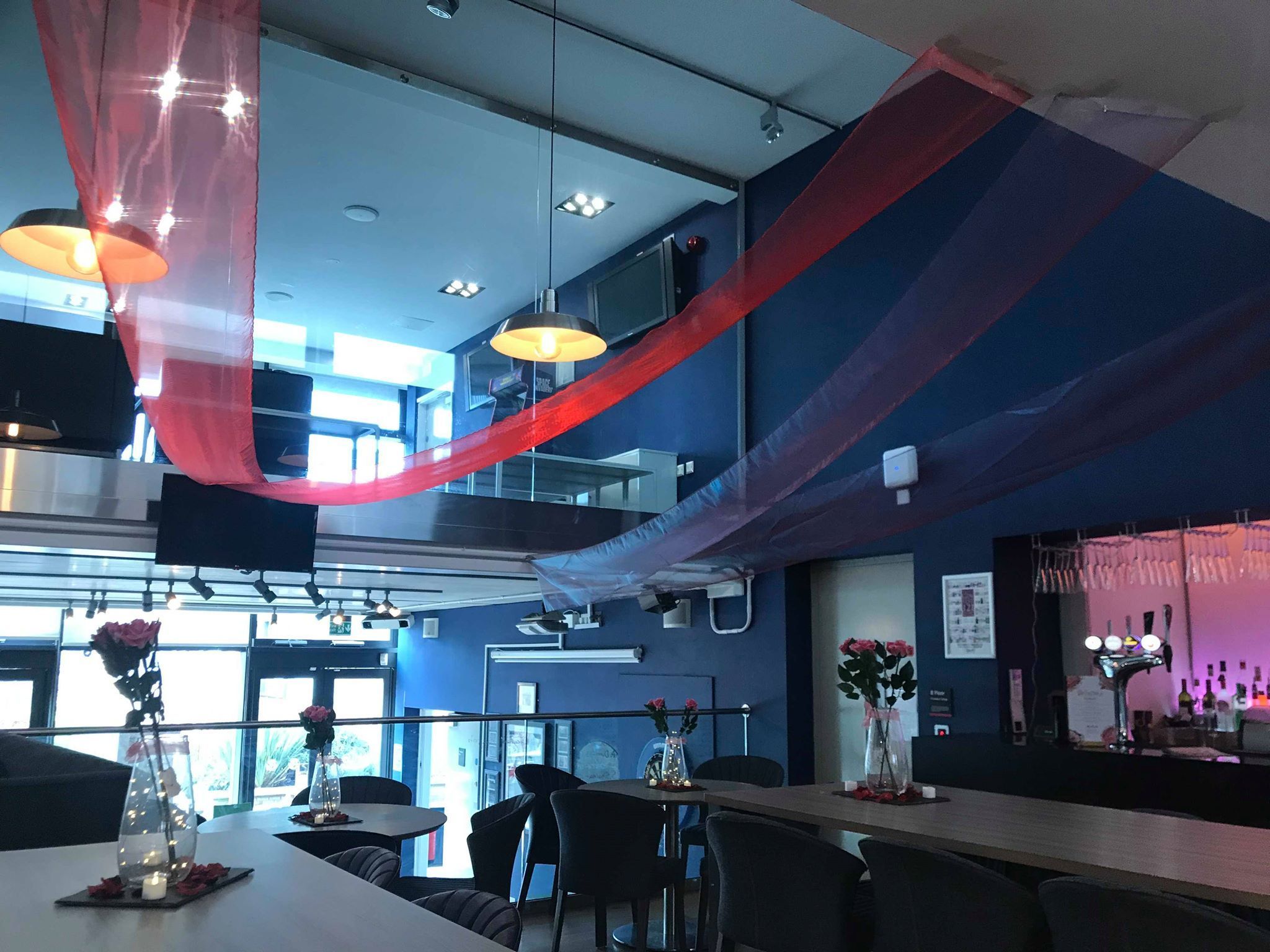 Image may contain: Bar Counter, Pub, Table, Meal, Food, Wood, Indoors, Interior Design, Lighting, Cafe, Cafeteria, Furniture, Chair, Restaurant