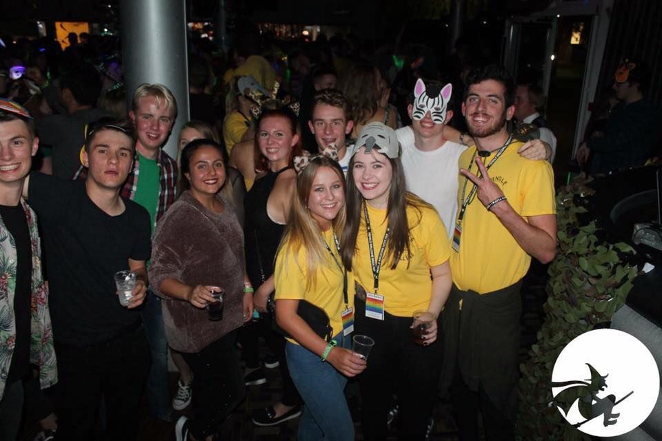 Image may contain: Pub, Bar Counter, Hat, Crowd, People, Night Club, Face, Club, Costume, Night Life, Apparel, Clothing, Party, Human, Person