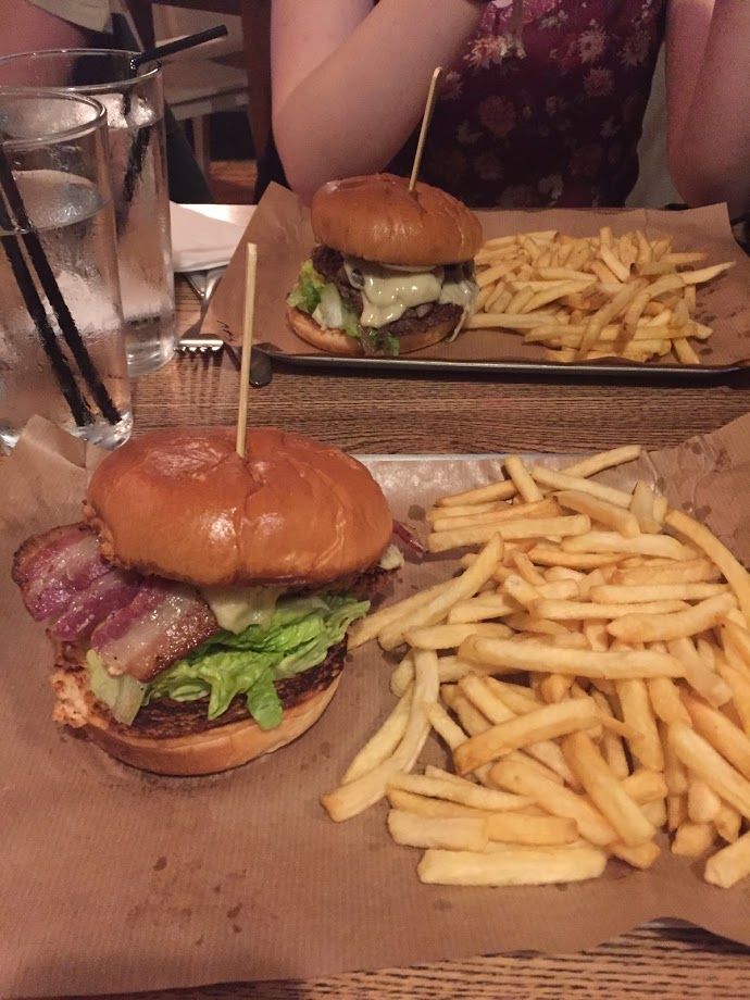 Image may contain: Fries, Human, Person, Burger, Food