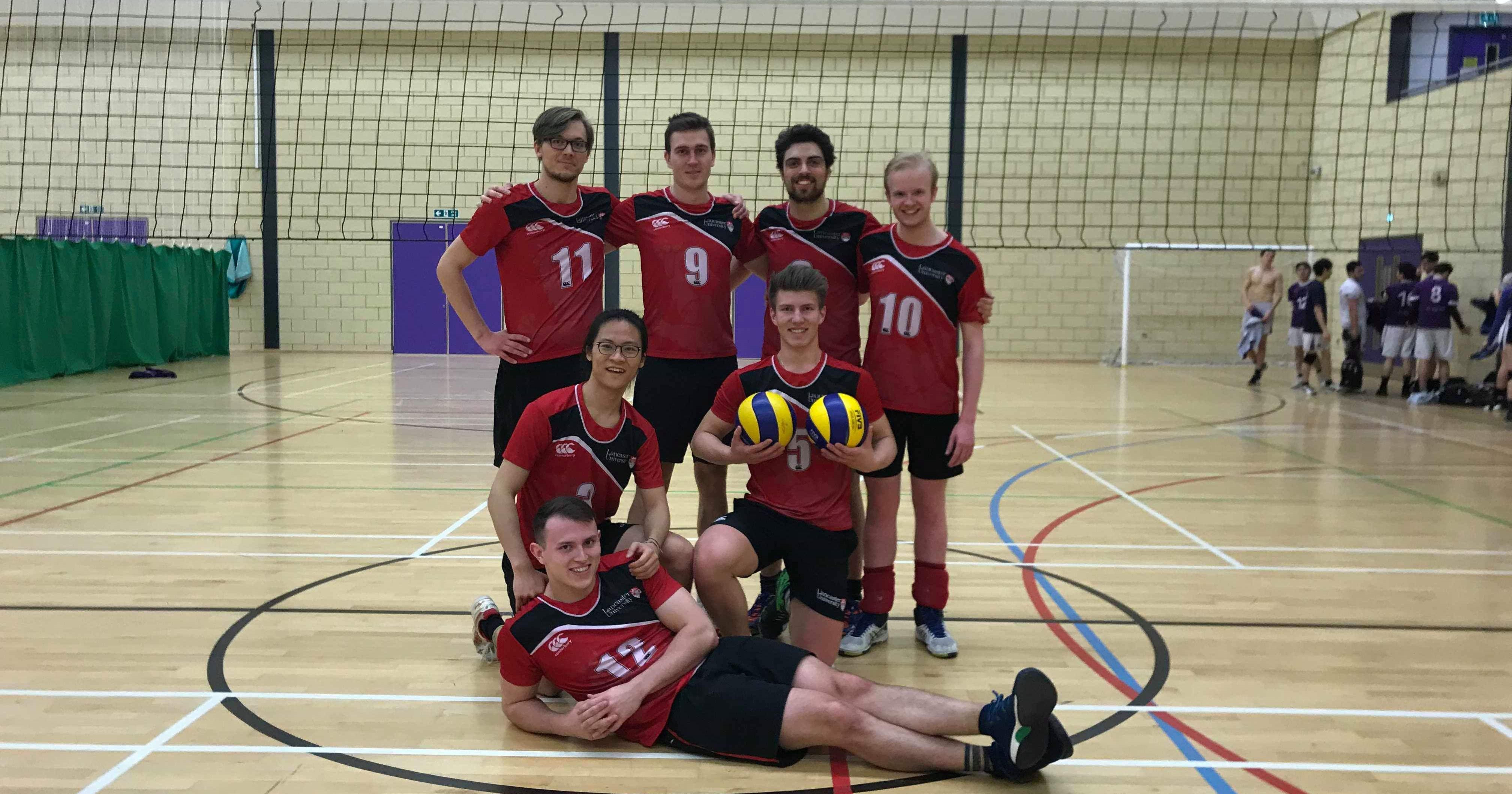 Image may contain: Volleyball, Floor, Sport, Team, Sports, Team Sport, Shorts, Ball, Apparel, Clothing, Flooring, People, Human, Person, Sphere