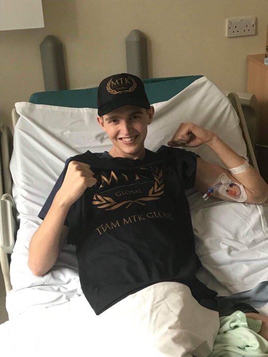 Image may contain: Face, Baseball Cap, Cap, Bed, Furniture, Hospital, Hat, Human, Person, Apparel, Clothing