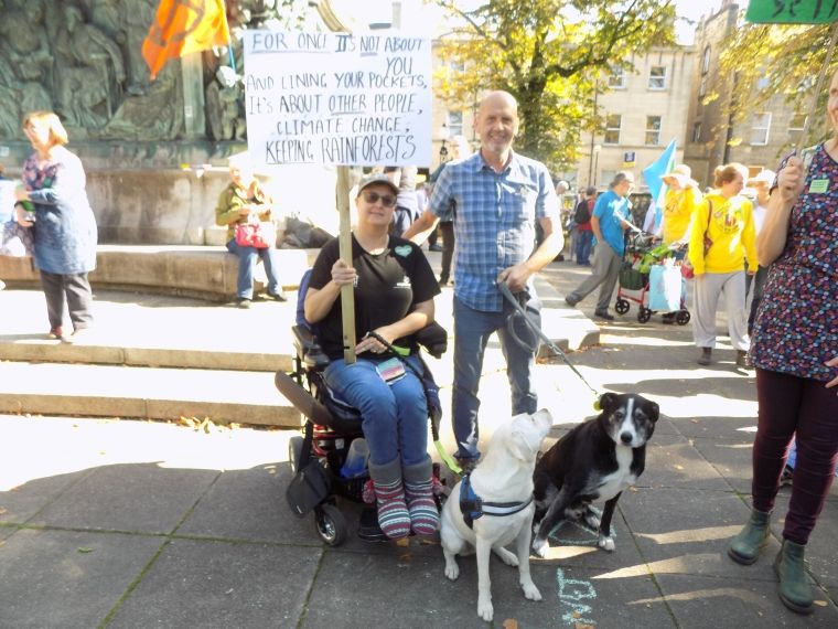 Image may contain: Strap, Denim, Jeans, People, Crowd, Pants, Canine, Mammal, Animal, Dog, Pet, Shoe, Clothing, Footwear, Apparel, Person, Human