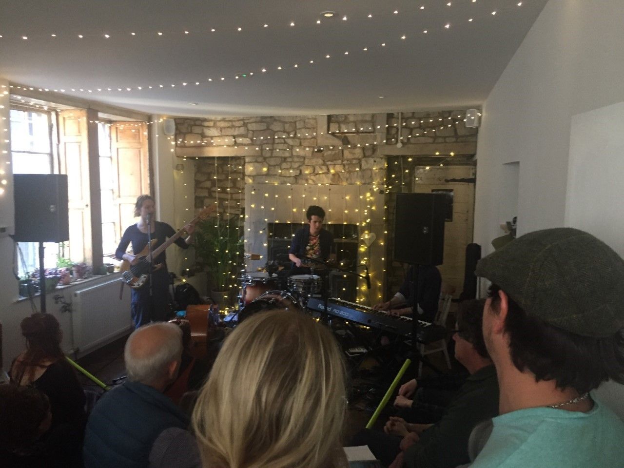 Image may contain: Monitor, Display, Screen, Hair, Electronics, City, Building, Metropolis, Town, Urban, Room, Living Room, Pub, Bar Counter, Leisure Activities, Guitar, Musical Instrument, Lighting, Indoors, Interior Design, Person, Human
