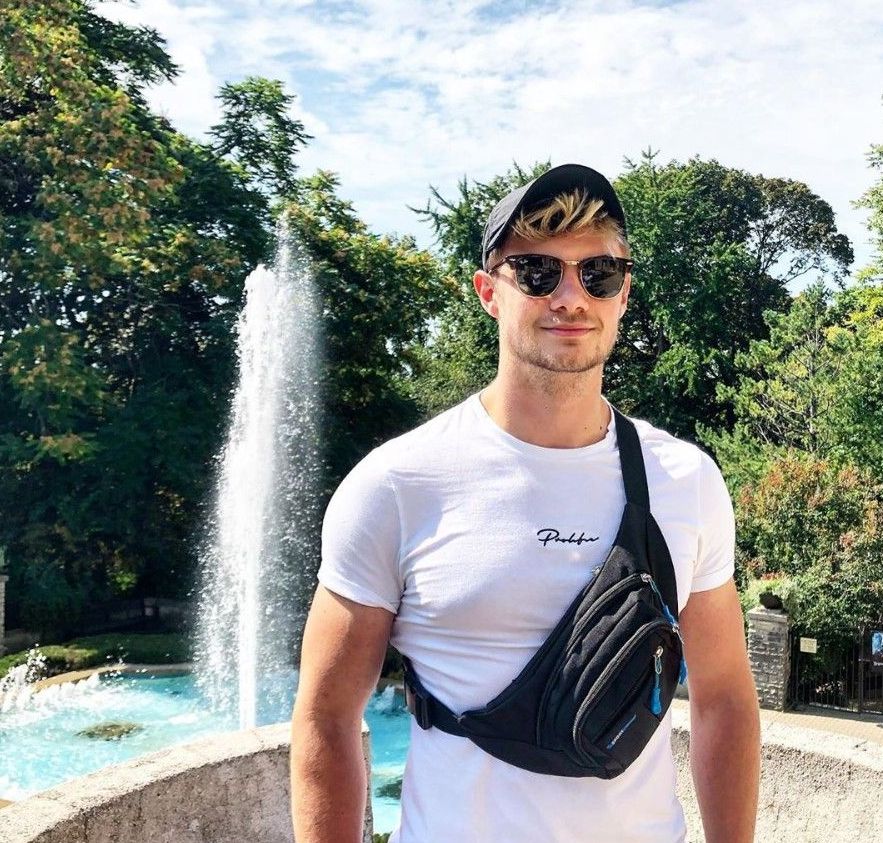 Image may contain: Vegetation, Tree, Plant, Pants, Shorts, Skin, Fountain, Clothing, Apparel, Accessories, Sunglasses, Accessory, Person, Human, Water