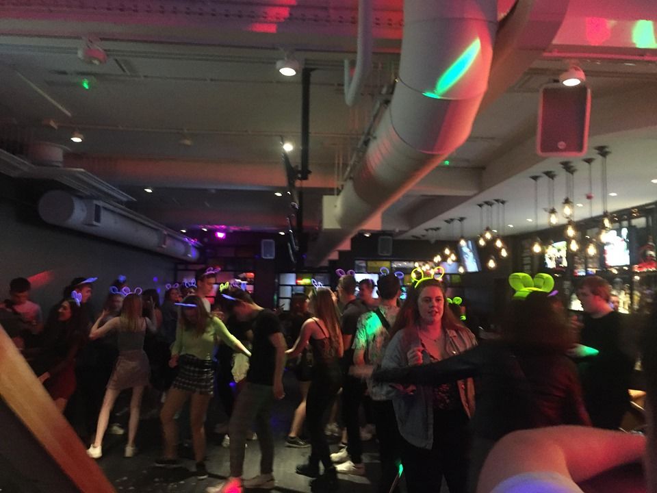 Image may contain: Party, Disco, Lighting, Night Life, Footwear, Apparel, Shoe, Clothing, Night Club, Club, Person, Human