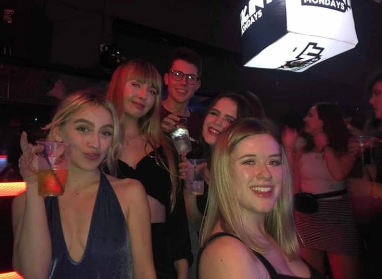 Image may contain: Face, Disco, Night Life, Night Club, Club, Party, Human, Person